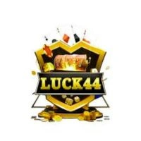 A gold and black shield logo featuring a treasure chest, gold bars, and the text "LUCK44" in bold letters.